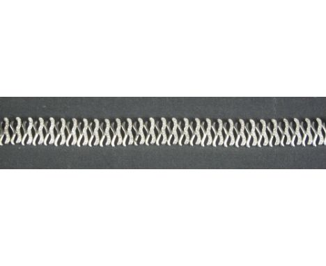 MODERN 18CT WHITE GOLD WAVE DESIGN GATE BRACELET, overall set with many diamond chips.   CONDITION REPORT:  28.4 grams.  Not 