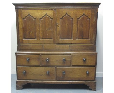 LATE 18TH CENTURY WELSH OAK TWO STAGE, LOW PRESS CUPBOARD, having moulded and reeded cornice above a pair of ogee pointed arc