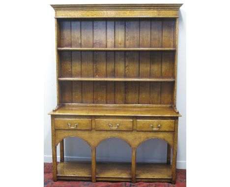 18TH CENTURY STYLE WELSH OAK POT BOARD DRESSER, having moulded cornice over boarded two shelf rack with three moulded drawers