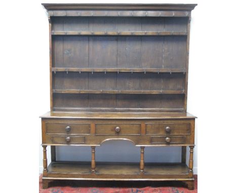 MID 19TH CENTURY WELSH OAK POT BOARD DRESSER, having boarded three shelf rack back with moulded cornice, the base with moulde