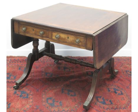 REGENCY MAHOGANY SOFA TABLE, having rosewood cross banding to the top, and drop flaps, two frieze drawers with brass knobs an