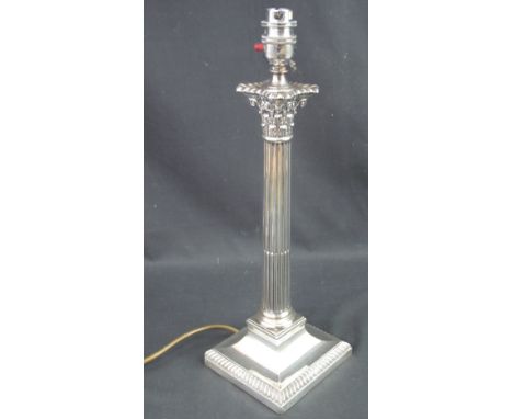 GEORGE V SILVER CORINTHIAN COLUMN TABLE LAMP having fluted column below band of acanthus leaf and scroll decoration, all rais