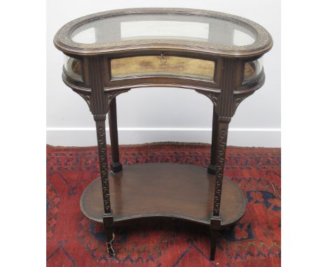 EARLY 20TH CENTURY MAHOGANY, KIDNEY SHAPED, VITRINE OR BIJOUTERIE CABINET, having overall strap work moulded decoration, squa