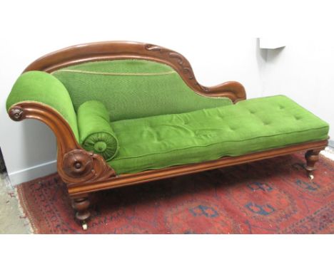 LATE VICTORIAN MAHOGANY SHOW FRAME CHAISE LOUNGE, having arched foliated moulded back, similar moulded scrolled end with bols