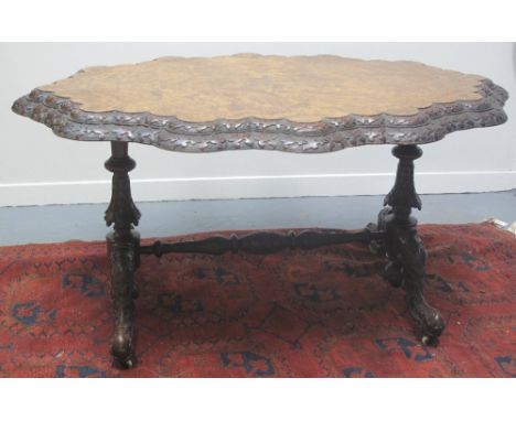 VICTORIAN BURR WALNUT, SCALLOPED EDGE, OVAL STRETCHER TABLE, having quarter veneered top with step moulded, foliate edge on b