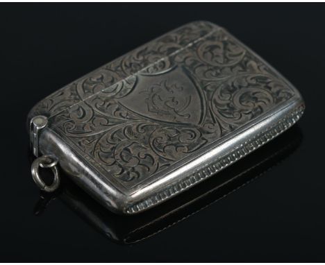 A George V silver vesta case, with central shield crest stamped 'CF'. Assayed for Birmingham, 1915 by Constantine &amp; Floyd