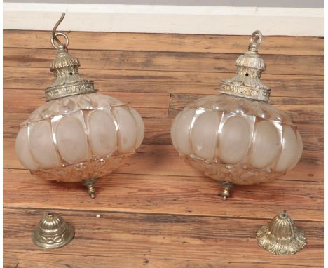 A pair of vintage glass and yellow metal light fittings.  