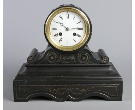 A black slate mantel clock, in drum shaped case on stepped rectangular plinth. With Roman Numeral dial.  Glass panel to the r