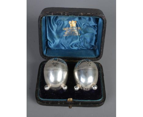 A cased pair of silver pepperettes. Assayed Sheffield 1891. 46g.  