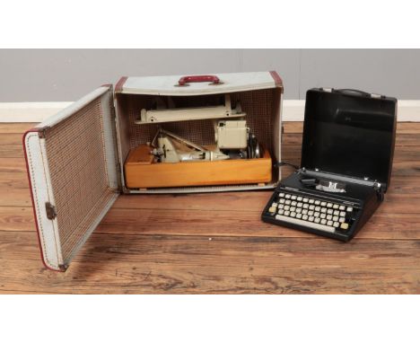 A cased Alfa sewing machine with accessories and Silver Reed Silverette portable typewriter.  