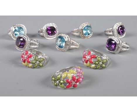 Ten large silver rings, set with large polished stones and painted flowers. All stamped 925. Total weight: 62.52g  