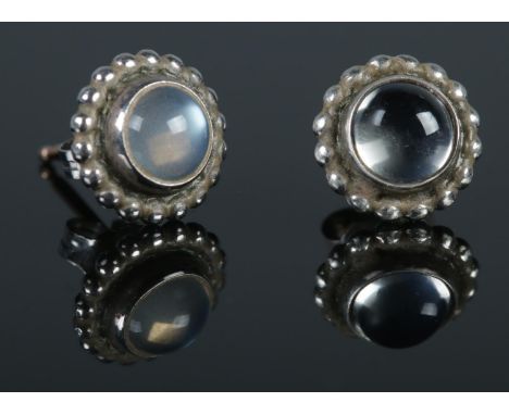 A pair of silver Georg Jensen moonstone stud earrings, with monogram mark to reverse.  