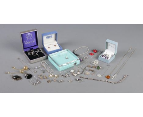 A large quantity of silver jewellery. To include necklace and earring suites, rings, pendants etc.  