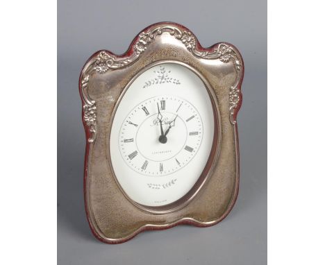 A silver mounted clock mantel clock. Assayed Sheffield 1994 by R.Carr.  