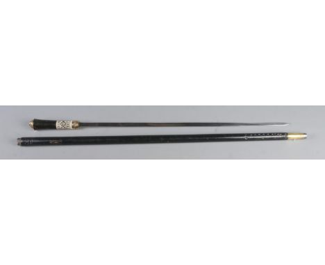 An Indian ebony sword stick featuring carved bone decoration and tigers head on hilt. CAN NOT POST OVERSEAS.  