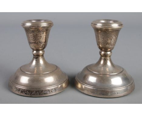 A pair of silver filled dwarf candlesticks. Assayed Birmingham 1979 by Parkin Silversmiths Ltd.  