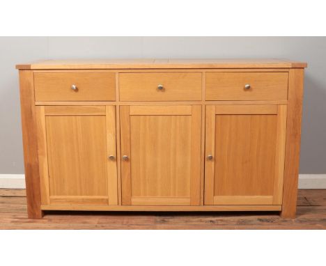 A light oak sideboard.  