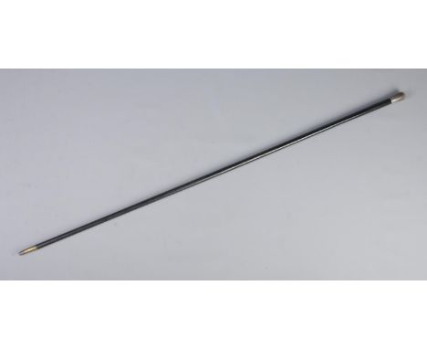 A Victorian ebonised walking cane with silver pommel. Assayed London 1886. Length 92cm.  