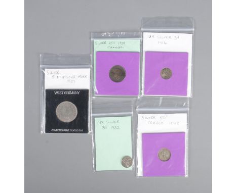 A quantity of global silver coins including British, French, Canadian and German examples.  
