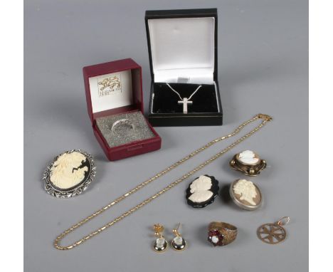A collection of jewellery, including silver ring, crucifix on silver chain, cameo jewellery and 9ct Gold earring.  Butterfly 