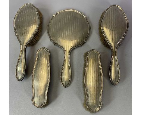 ART DECO PERIOD 5 PIECE SILVER DRESSING TABLE SET - comprising hand mirror, two large brushes and two small brushes, all havi