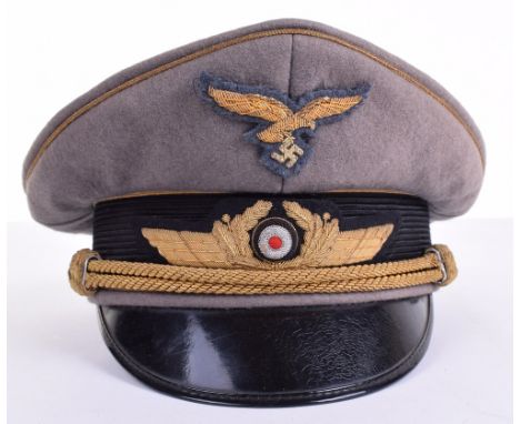 WW2 Luftwaffe Generals Peaked Cap, with bullion wire eagle and cockade insignia. Gold wire piping to the crown and bordering 