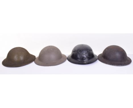Four British Steel Helmets, including combat example with original liner, chinstrap and camouflage net cover; WW2 Civil Defen