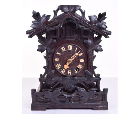 Black Forrest Cuckoo Table Clock, good quality striking pendulum movement, finely carved case, roman numerals to dial and ori