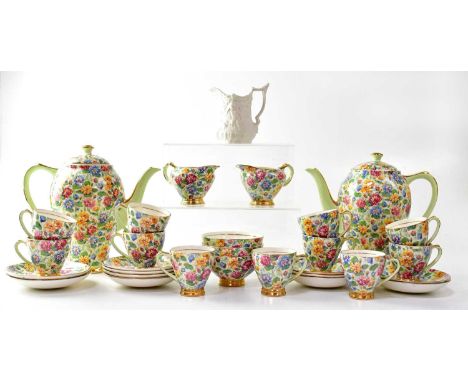 EMPIRE; a twelve-setting 'Water Lily' chintz part coffee service, comprising two coffee pots, eleven demitasse coffee cups, e