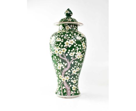 A large Chinese lidded vase decorated with cherry blossom on a green ground, height approx. 47cm.Condition Report: - Chips to