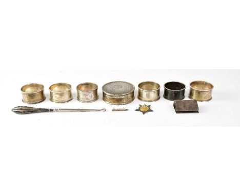 A collection of hallmarked silver items to include napkin rings, trinket box (af), combined approx. 6ozt, also a silver prize