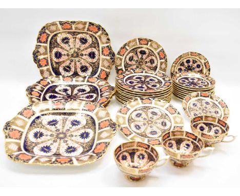 ROYAL CROWN DERBY; a twenty-nine piece 'Japan' pattern, no. 9021, part dinner service, comprising three cups, four square pla