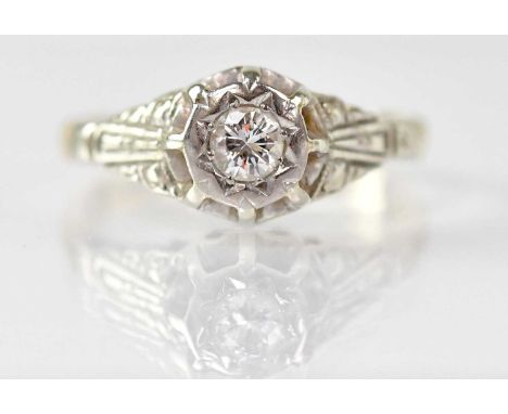 An 18ct yellow gold ring with an illusion set diamond, size K, approx. 3.8g.