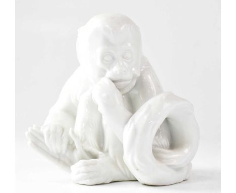 ROYAL VIENNA; a 20th century blanc de Chine porcelain model of a seated monkey holding its foot, by Robert Ullmann, printed m