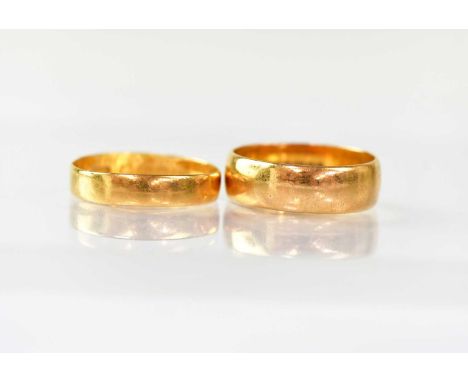 Two 22ct gold wedding bands, size K and size L, combined approx. 5.6g (2).