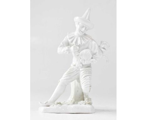 LUDWIGSBURG; a 20th century blanc-de-chine figure of a Harlequin pulling a pug's tail, after Johann Joachim Kändler, painted 