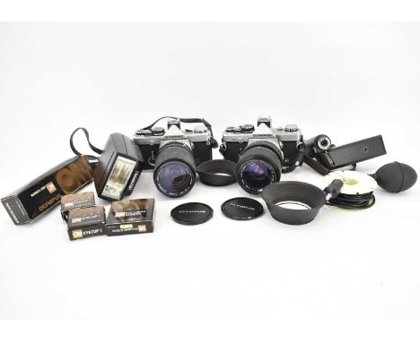 OLYMPUS; two vintage model OM-2N SLR cameras, one with Olympus Zuiko auto-zoom 35-105mm 1:3.5-4.5 lens, the other with Olympu