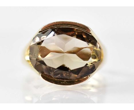 A 9ct yellow gold ring set with an oval smoky quartz, size K, approx. 5.9g.