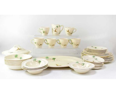 ROYAL DOULTON; a part dinner service in 'The Coppice' pattern no. D5803, decorated with pheasants in a pine landscape, compri