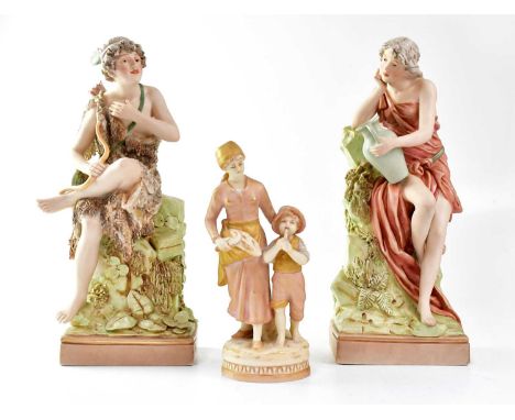 ROYAL DUX; a pair of figures, one holding a bow with quiver of arrows at his back, the other a lady in Classical dress, holdi