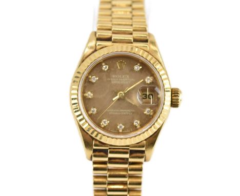 ROLEX; a ladies' 18ct yellow gold 'Oyster Perpetual Datejust Superlative Chronometer' wristwatch, serial no. R251078, the cha