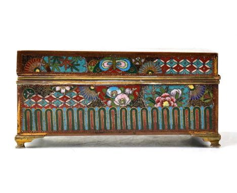 A Japanese cloisonné cigarette box decorated with fans and circular motifs with floral and geometric decoration, the base ena