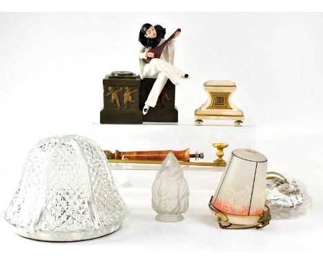 A collection of various lamps and light fittings to include a cast metal seated Pierrot playing a lute, with torch flame-shap