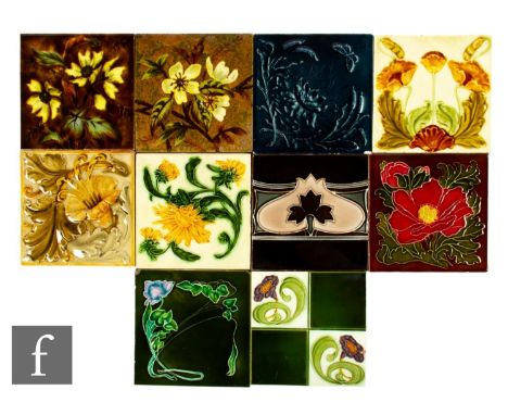 A collection of late 19th and early 20th Century dust pressed 6 inch tiles, all with relief moulded Art Nouveau foliate decor