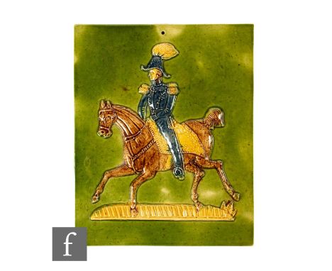 A 20th Century plastic clay pictorial tile, high relief moulded decoration of the Duke of Wellington on horseback, tonal brow