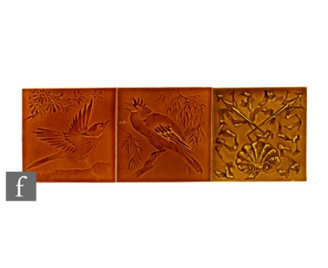 A pair of early 20th Century Pilkington's 6 inch dust pressed tiles, each decorated with impressed birds from the Japanese Bi