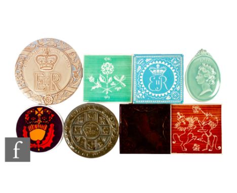 A collection of 20th Century royal commemorative tiles and plaques relating to Edward VII, Edward VII and Elizabeth II, to in