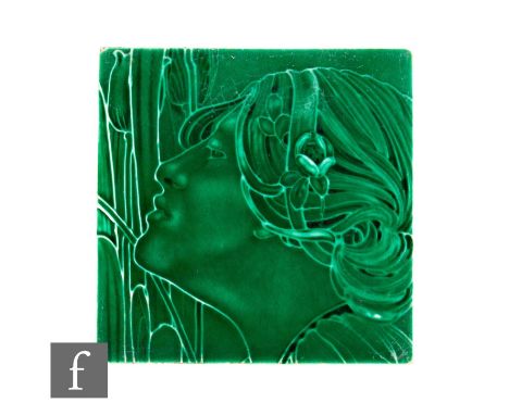 An early 20th Century J &amp; W Wade for Flaxman Tile Works 6 inch dust pressed tile, one of a pair, with slip trailed decora