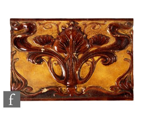 A large 19th Century Burmantofts architectural ceramic panel, moulded in high relief with a stylised Art Nouveau floral desig