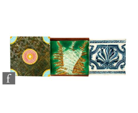 A 19th Century 8 inch Copeland plastic clay tile relief moulded in the Aesthetic taste with central and corner roundels over 